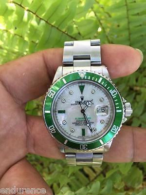 ROLEX MENS SUBMARINER STAINLESS STEEL GREEN BEZEL WHITE MOTHER OF PEARL  diamonds